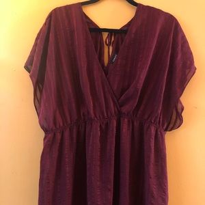 Beautiful merlot hued top with cute back detail!